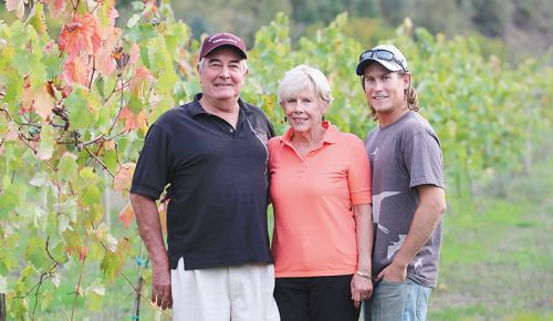 Mike and Pam Freed standing with son Bryan in the family s vineyard during October 2014. ## Photo provided by Freed Estate Winery