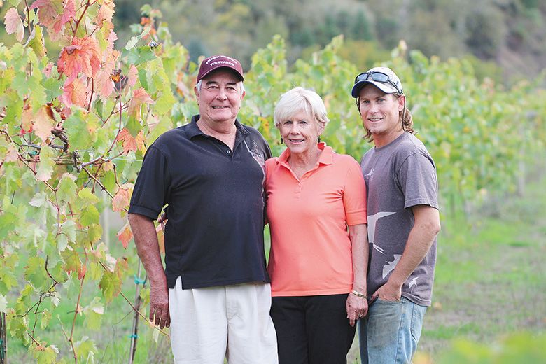 Mike and Pam Freed standing with son Bryan in the family s vineyard during October 2014. ## Photo provided by Freed Estate Winery