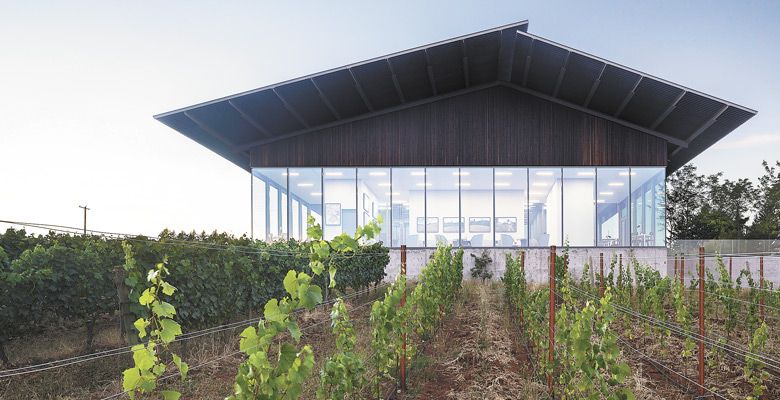 Furioso Vineyards’ tasting room uses glass for walls, offering an incredible view of the surrounding Dundee Hills. ##Photo by Laura Swimmer