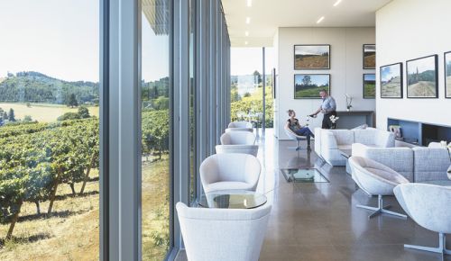 Tasting room manager Jim McGuire pours a glass for a guest inside Furioso’s modern space. ##Photo by Laura Swimmer