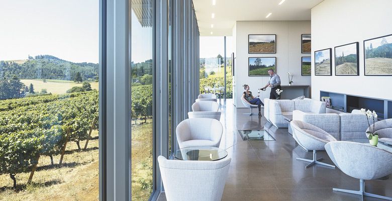 Tasting room manager Jim McGuire pours a glass for a guest inside Furioso’s modern space. ##Photo by Laura Swimmer