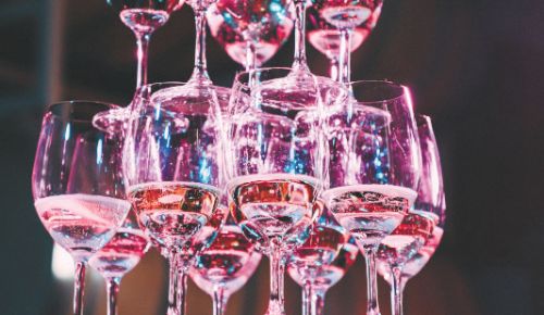 A tower of glasses filled with sparkling wine. ## Photo by Lauren D