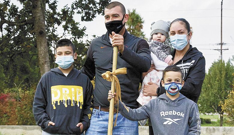 MacHabitat has chosen the Gonzalez family for its new charity house in partnership with the Willamette Valley Wineries Association. The family stands on the future house site. ##Photo by Adrian Chitty