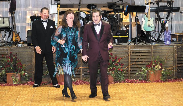 With Diana Rudd by his side,
Pat Spangler accepts a gold medal for
Spangler Vineyards 2015 Carménère at
last year’s Greatest of the Grape. ##Photo provided