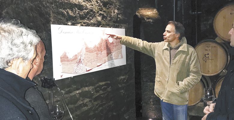 Jean-Nicolas Méo leads a tour in the cellar of Domaine Méo-Camuzet.  ##Photo by L.M. Archer