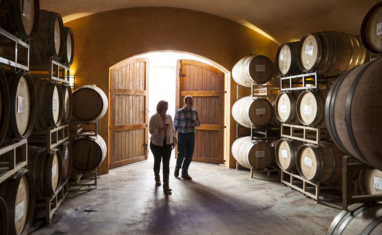 Laurine and Alfredo Apolloni of Apolloni Vineyards walks in their barrel room located on the estate, which is situated in the soon-to-be called Tualatin Hills AVA. ##Photo provided