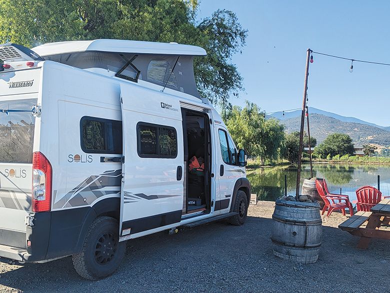 A campervan parked near a picnic table and chairs with a view of the lake, vineyards and mountains. ## Photo provided by Harvest Hosts A campervan parked near a picnic table and chairs with a view of the lake, vineyards and mountains. ## Photo provided by Harvest Hosts