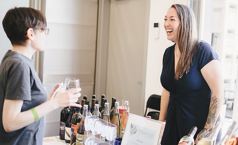 Circadian Cellars  owner and winemaker Sara Garr pouring wine at Indie Wine Mixer: Southern Oregon edition. Five percent of event ticket sales supported Rogue Food Unites, an organization feeding area residents. ## Photo by Hannah Corella