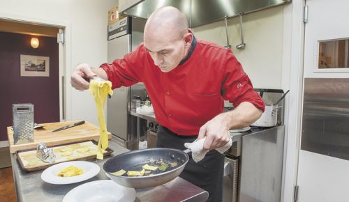 AgriVino chef Dario Pisoni prepares pappardelle al tartufo. ##Photo by Marcus Larson