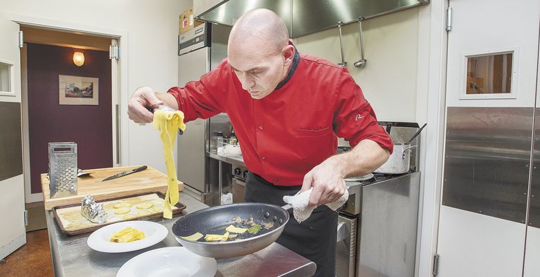 AgriVino chef Dario Pisoni prepares pappardelle al tartufo. ##Photo by Marcus Larson