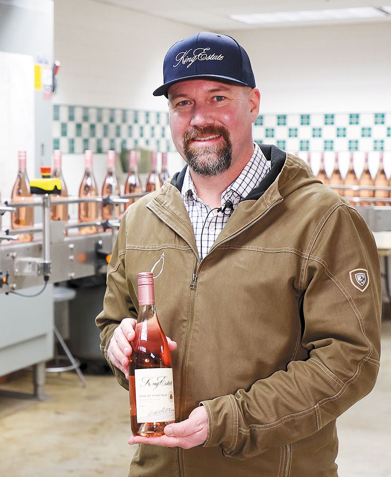 Brent Stone, King Estate’s winemaker, holding a bottle of rosé. ## Photo provided by King Estate Brent Stone, King Estate’s winemaker, holding a bottle of rosé. ## Photo provided by King Estate