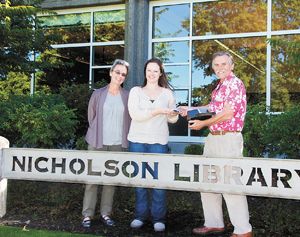 From left: Linfield Library Director Susan Barnes Whyte, archivist Rachael Woody and Janis Miglavs.