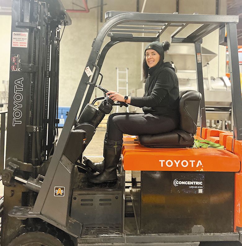 Jennifer Warner, founder of the Dagger Daisy wine brand, driving a forklift while making wine in AVP’s incubator program. ## Photo provided by AVP Wine Collective Jennifer Warner, founder of the Dagger Daisy wine brand, driving a forklift while making wine in AVP’s incubator program. ## Photo provided by AVP Wine Collective