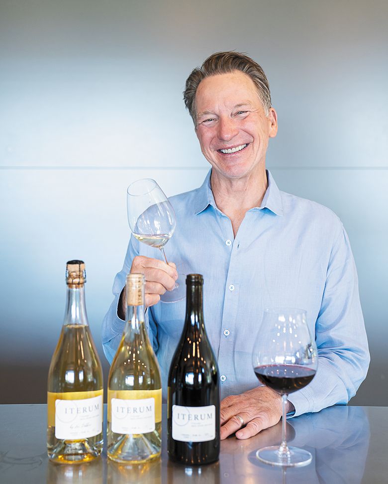 Iterum Wines’ owner and winemaker Joe Dobbes with three bottles of his wine. ## Photo provided by Iterum Wines