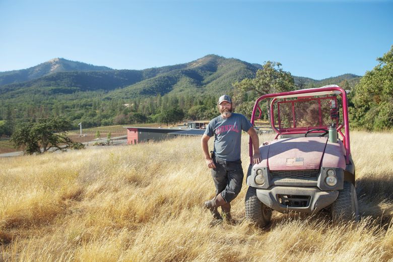 Herb Quady, the Oregon Wine Press 2023 Person of the Year, standing next to the Mule, a 2004 Kawasaki that continues to run great.##Photo By John Valis, courtesy of the Oregon Wine Board