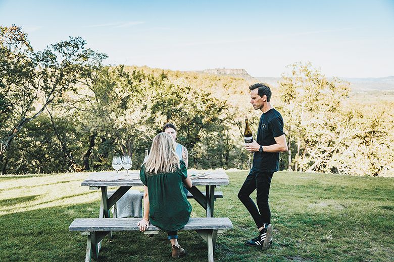 Winemaker Jon LeBars pouring wines for guests. ## Photo by Aaron Hagen, Beartooth Media