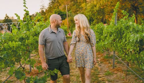 Leon and Kayla Glaser, owners of JosephJane Winery, walking in the vineyard. ## Photo provided