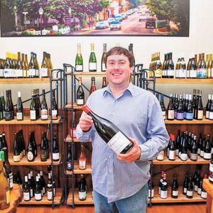 Josh Kimball selling wine in his shop in downtown Jacksonville. ##Photo provided