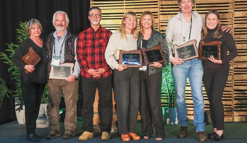 Oregon Wine industry leaders receiving awards at the recent Oregon Wine Board-hosted Symposium. From left: Connie Fuller (on behalf of her deceased husband Bill Fuller), Dai Crisp, Mario Fandino, Shannon Mayhew, Maria Ponzi, Gary Mortensen and  Carole Skeeters-Stevens. ## Photo by Kelly Lyon