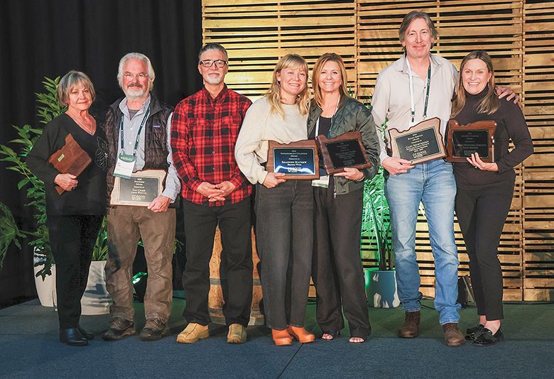 Oregon Wine industry leaders receiving awards at the recent Oregon Wine Board-hosted Symposium. From left: Connie Fuller (on behalf of her deceased husband Bill Fuller), Dai Crisp, Mario Fandino, Shannon Mayhew, Maria Ponzi, Gary Mortensen and  Carole Skeeters-Stevens. ## Photo by Kelly Lyon