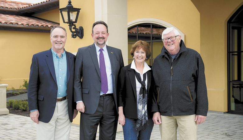 Linfield University Center for Wine Education Director Greg Jones, former Linfield President Thomas Hellie, and Grace and Ken Evenstad celebrate the endowment at Domaine Serene outside Dayton in 2018. 
 ##Photo courtesy of Domaine Serene