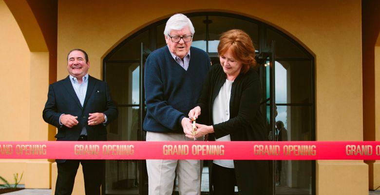 Culinary icon Emeril Lagasse watches as owners Ken and Grace Evenstad cut the ribbon of The Clubhouse at Domaine Serene, a 34,000-square-foot event facility on the winery’s estate vineyard. ##Photo Courtesy of Domaine Serene