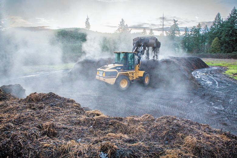 Steam rises from the freshly turned compost pile at King Estate.##Photo by Andy Nelson