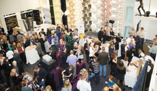 Guests at the 2012 Kohler Food & Wine Experience in Kohler, Wisc., gather in Kohler Co.’s showroom for a gourmet celebration.