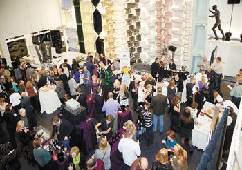 Guests at the 2012 Kohler Food & Wine Experience in Kohler, Wisc., gather in Kohler Co.’s showroom for a gourmet celebration.