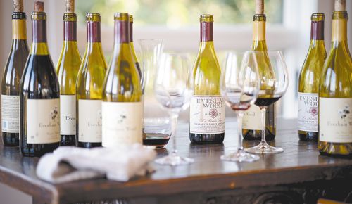 Open bottles and wine glasses at the Evesham Wood 40th anniversary celebration. ## Photo by Alexander Fortson