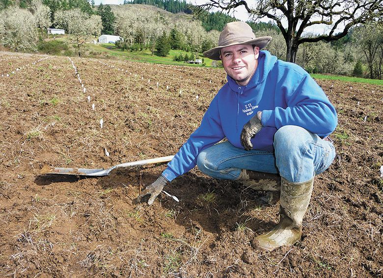 Lex&egrave;me Wines&rsquo; owner, Christopher Hudson, planting grapevines. ## Photo provided by Lex&egrave;me Wines