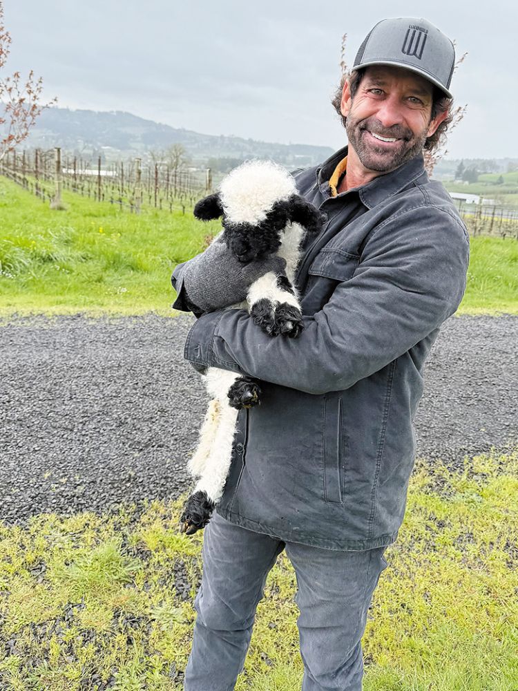 Owner Blair Nicholas holding a lamb. ## Photo provided by LucidWild