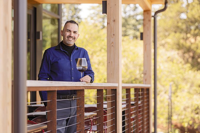 Luis Romero serving a glass of wine on the deck at Elk Cove Vineyards. ## Photo by Anna Campbell Luis Romero serving a glass of wine on the deck at Elk Cove Vineyards. ## Photo by Anna Campbell