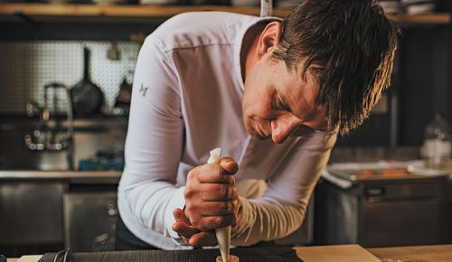 MÄS chef Dorcak creating a restaurant dish. ##Photo by Lindsey Bolling Photography