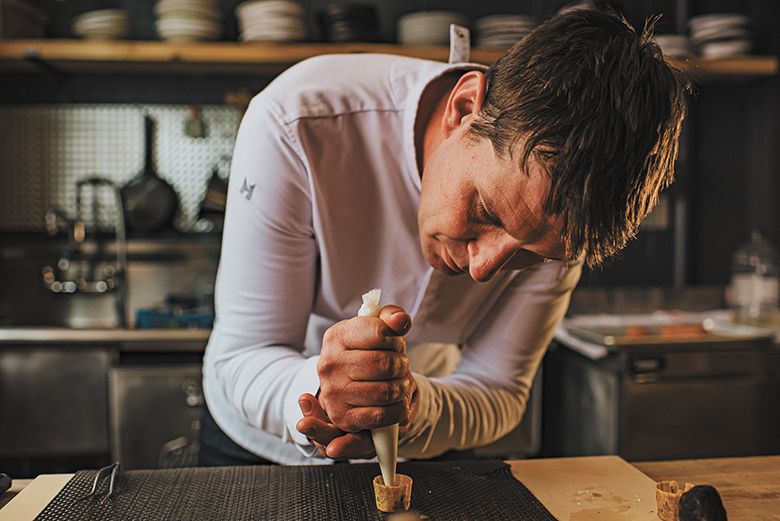 MÄS chef Dorcak creating a restaurant dish. ##Photo by Lindsey Bolling Photography