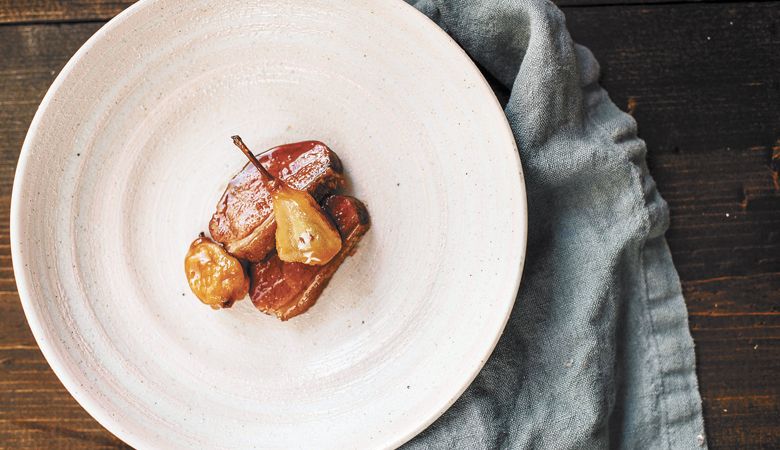 Aged duck breast lacquered with Seckel pear juice and preserved Seckel pear. ##Photo by Lindsey Bolling