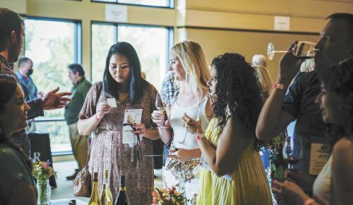 Friends enjoy the Chehalem Mountains Winegrowers’ Magic in the Mountains tasting in Newberg at The Allison Inn & Spa.##Photo by Raymond Hall/Click Photography