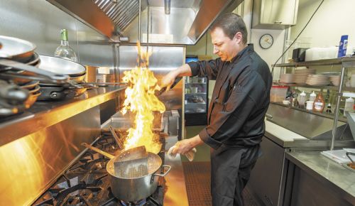 Chef Matthew Holeman fires up dinner at Matthew’s Ristorante in Dayton.  ##Photo by Marcus Larson