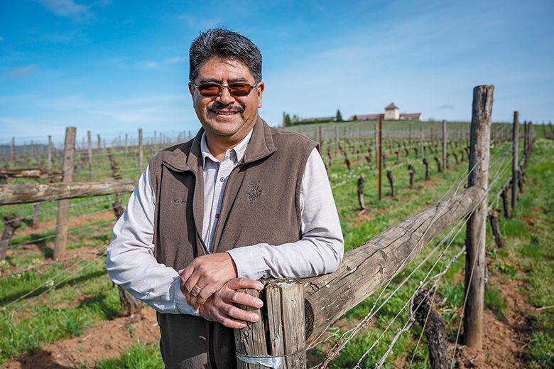 King Estate s vineyard manager, Meliton Martinez, standing in the King Estate Vineyard. ## Photo by Andy Nelson