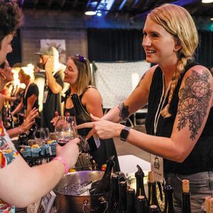 An attendee at the heavy metal-themed festival Blood of Gods Annual Merrymaking receiving a wine sample. ## Photo provided by Blood of Gods
