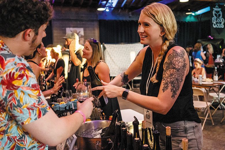 An attendee at the heavy metal-themed festival Blood of Gods Annual Merrymaking receiving a wine sample. ## Photo provided by Blood of Gods