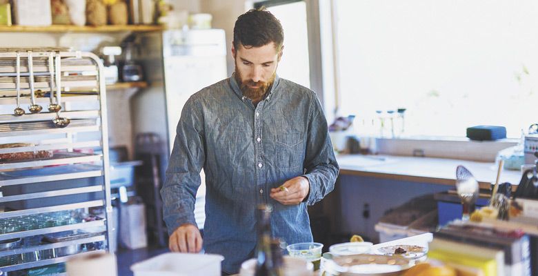 Winemaker Graham Markel of Buona Notte “at home” in the kitchen. ##Photo by Joshua Chang