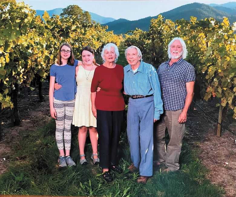 From left: Grandchildren Anya and Savonne stand with grandparents Traute and Don Moore and father Michael.##Photo provided