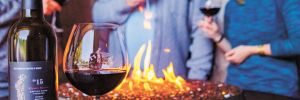 Visitors stay toasty around a fire pit at Pete’s Mountain Vineyard & Winery in West Linn.##Photo provided