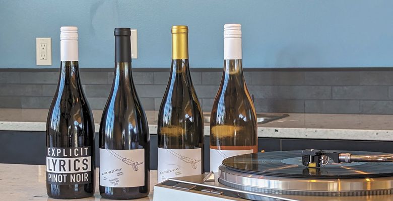 A visit to Longplay Wines includes listening to a curated selection of music albums on the record player.##Photo by Todd Hansen of Longplay Wines