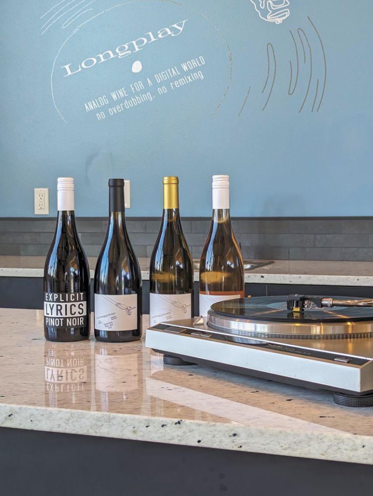 A visit to Longplay Wines includes listening to a curated selection of music albums on the record player.##Photo by Todd Hansen of Longplay Wines