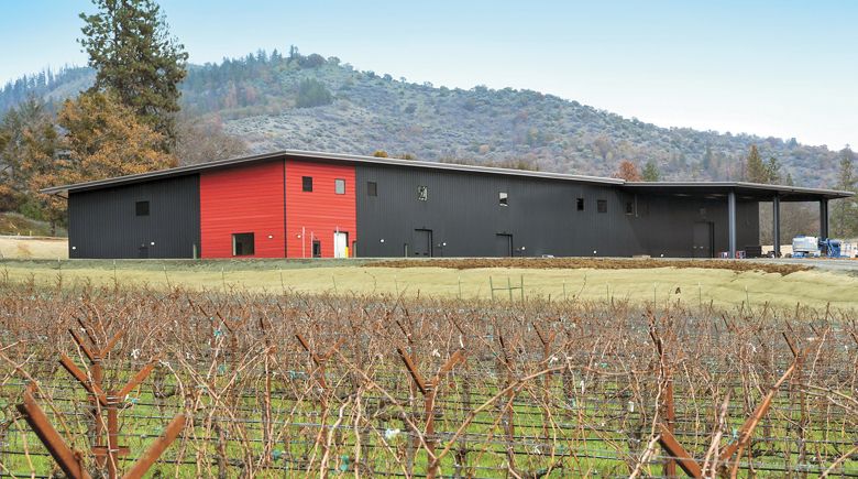 The new building, overlooking dormant winter greapevines, contains Quady North s tasting room plus a shared winemaking space occupied by Barrel 42 and Quady North.##Photo provided by Quady North