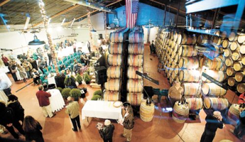 Guests gather at the eighth annual Flavors of Carlton hosted at Ken Wright Cellars.  It is the gala auction for Carlton Together Cares.  Photo by Marcus Larson.