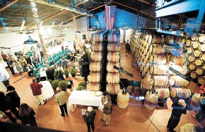 Guests gather at the eighth annual Flavors of Carlton hosted at Ken Wright Cellars.  It is the gala auction for Carlton Together Cares.  Photo by Marcus Larson.