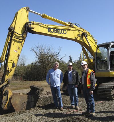 Laurent Montalieu, of NW Wine Company; Matt Pihl, of Pihl, Inc.; and Dave Wheeler, of Perlo Construction, join forces at the NW groundbreaking.  Photo provided.